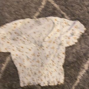 Shirt never worn- in perfect condition. Sunflowers on shirt